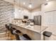 Modern kitchen with stainless steel appliances and an island with seating at 891 Ocean Course Ave # 0, Davenport, FL 33896