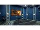 Community theater room features comfortable seating and a large screen at 891 Ocean Course Ave # 0, Davenport, FL 33896
