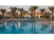 Resort-style pool with a clubhouse, playground, and palm trees at 891 Ocean Course Ave # 0, Davenport, FL 33896