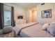 Bright bedroom with king-size bed, TV, and access to balcony at 891 Ocean Course Ave # 0, Davenport, FL 33896