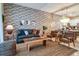 Spacious living room with comfortable seating and brick feature wall at 891 Ocean Course Ave # 0, Davenport, FL 33896