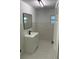 Modern bathroom with a floating vanity and large mirror at 1204 Lake Elbert Se Dr, Winter Haven, FL 33880