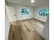 Bright bedroom featuring new wood-look flooring and fresh paint at 1204 Lake Elbert Se Dr, Winter Haven, FL 33880
