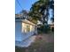 Side view of the house showcasing a new paint job and landscaping at 1204 Lake Elbert Se Dr, Winter Haven, FL 33880