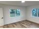 Spacious bedroom with large windows and light wood flooring at 1204 Lake Elbert Se Dr, Winter Haven, FL 33880