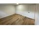 Bright bedroom with light wood floors and double door closet at 1204 Lake Elbert Se Dr, Winter Haven, FL 33880