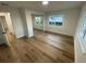 Light and bright bedroom with wood floors and mirrored closet at 1204 Lake Elbert Se Dr, Winter Haven, FL 33880