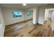 Well-lit bedroom with mirrored closet doors and wood-look flooring at 1204 Lake Elbert Se Dr, Winter Haven, FL 33880