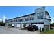 Modern building exterior with attached garages and neutral colors at 1670 Houston St, Kissimmee, FL 34743