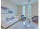 Bright and airy living room with neutral furniture and large windows at 1670 Houston St, Kissimmee, FL 34743