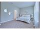 Bright bedroom with neutral decor and plush carpeting at 1670 Houston St, Kissimmee, FL 34743