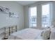 Serene bedroom with soft color scheme and natural light at 1670 Houston St, Kissimmee, FL 34743