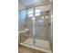 Spacious shower with glass enclosure and tiled walls at 1670 Houston St, Kissimmee, FL 34743