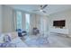 Open concept living room featuring a neutral color palette and ample natural light at 1670 Houston St, Kissimmee, FL 34743