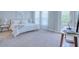 Spacious main bedroom with plush carpet, neutral decor, and private balcony access at 1670 Houston St, Kissimmee, FL 34743