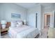 Bright bedroom with double doors leading to closet and ensuite bathroom at 1680 Houston St, Kissimmee, FL 34743