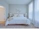 Main bedroom with large bed and plenty of natural light at 1680 Houston St, Kissimmee, FL 34743