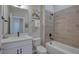 Bathroom with a bathtub, toilet and modern vanity at 1700 Houston St, Kissimmee, FL 34743