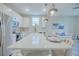 Modern kitchen island with seating and white cabinets at 1700 Houston St, Kissimmee, FL 34743