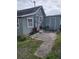 Quaint house exterior with a small front porch and side yard at 700 Kentucky Ave, St Cloud, FL 34769