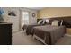 Bedroom with two twin beds and brown bedding at 3060 Gatsby St, Kissimmee, FL 34746