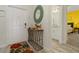 Bright entryway with decorative mirror and contemporary console table at 3060 Gatsby St, Kissimmee, FL 34746