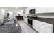 Modern kitchen featuring stainless steel appliances and granite countertops at 2928 Sunridge Loop, Saint Cloud, FL 34771