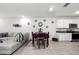 Kitchen and dining area with granite counters, white cabinets, and tile floors at 2928 Sunridge Loop, Saint Cloud, FL 34771