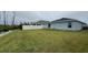 Large backyard with pond and privacy fence at 305 Cascara Ln, Auburndale, FL 33823