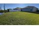 Large backyard with pond and privacy fence at 305 Cascara Ln, Auburndale, FL 33823