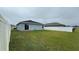 Grass backyard with a view of a house at 305 Cascara Ln, Auburndale, FL 33823
