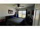 Bedroom with a double bed, desk, and window at 305 Cascara Ln, Auburndale, FL 33823