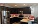 Modern kitchen with stainless steel appliances and dark cabinets at 305 Cascara Ln, Auburndale, FL 33823