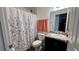 Clean bathroom with shower/tub combo, toilet and vanity at 305 Cascara Ln, Auburndale, FL 33823
