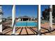 Inviting pool with a pergola and surrounding homes visible at 1580 Wynell St, St Cloud, FL 34771