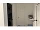 Hallway with laundry and storage access at 1580 Wynell St, St Cloud, FL 34771