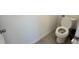 Simple, clean bathroom with a toilet and gray tile floors at 1580 Wynell St, St Cloud, FL 34771