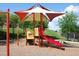 playground with shade structure, slide, and play area at 8403 Blue Lagoon Dr, Kissimmee, FL 34747