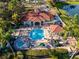 Aerial view of community pool, spa, and clubhouse at 8403 Blue Lagoon Dr, Kissimmee, FL 34747