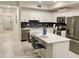 Modern kitchen with stainless steel appliances, an island, and ample counter space at 3131 Paradox Circle # 207, Kissimmee, FL 34746
