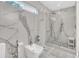 Spa-like bathroom with marble walls, a walk-in shower, and a bidet at 7920 Summer Ridge Pl, Orlando, FL 32819