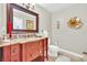 Elegant bathroom with granite vanity, updated fixtures, and decorative wall art at 7920 Summer Ridge Pl, Orlando, FL 32819