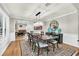 Elegant dining room with hardwood floors, a large table, and stylish chandelier at 7920 Summer Ridge Pl, Orlando, FL 32819