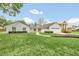 A charming house with stone exterior, neatly landscaped lawn and a welcoming front entrance at 7920 Summer Ridge Pl, Orlando, FL 32819