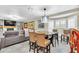 Bright kitchen boasts granite counters, breakfast bar, and adjacent living area at 7920 Summer Ridge Pl, Orlando, FL 32819