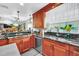 Large kitchen with granite countertops, double sink, and ample cabinet space at 7920 Summer Ridge Pl, Orlando, FL 32819
