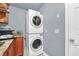 Convenient laundry room with stackable LG washer and dryer at 7920 Summer Ridge Pl, Orlando, FL 32819