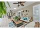 Relaxing patio with comfortable seating and ceiling fan at 7920 Summer Ridge Pl, Orlando, FL 32819