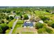 Aerial view of a house and expansive property with mature trees at 6747 Whispering Pines Rd, Orlando, FL 32824