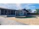 Inviting kidney-shaped pool with brick patio and landscaping at 6747 Whispering Pines Rd, Orlando, FL 32824